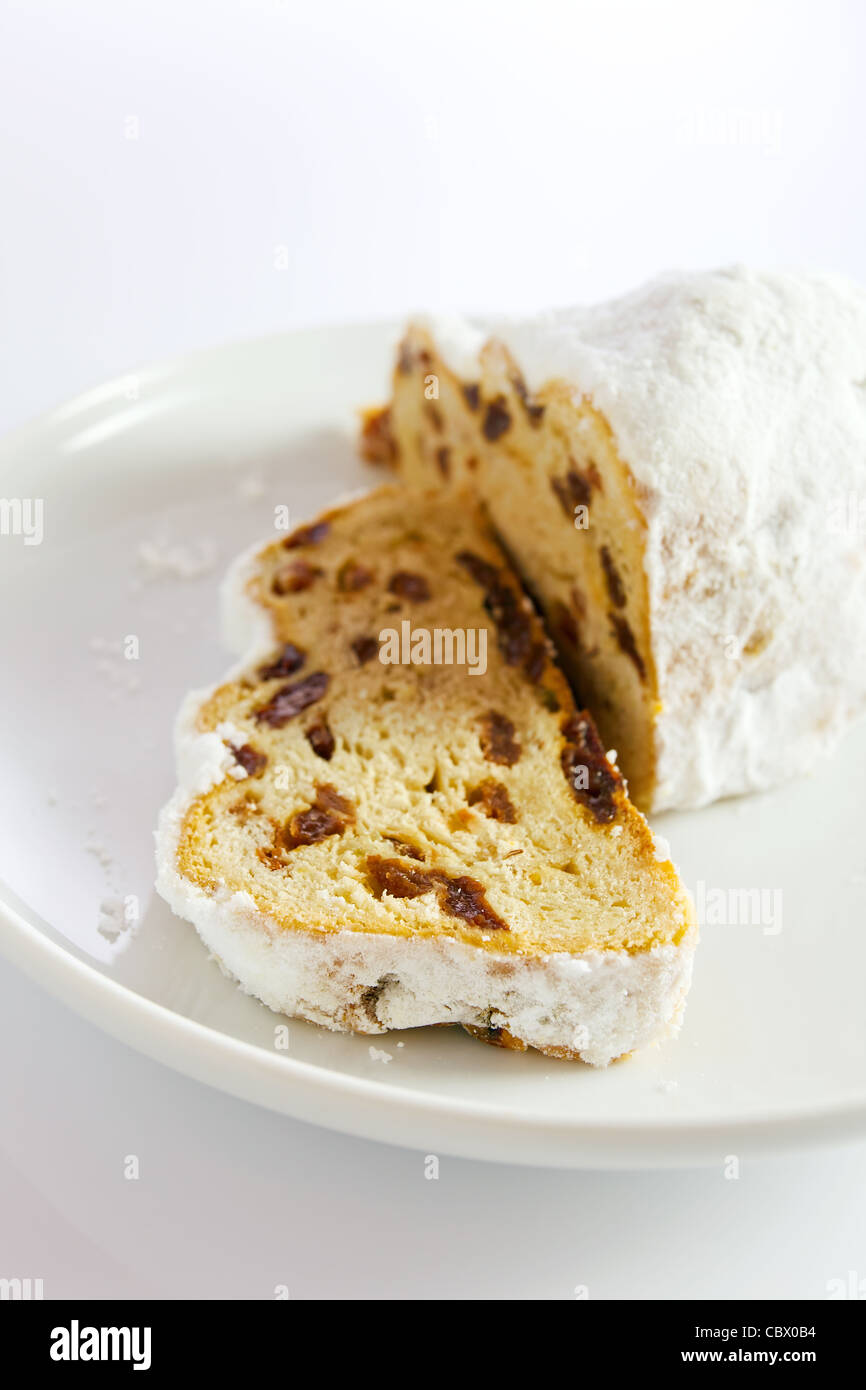 Fruitcake with raisins on a white plate. Stock Photo