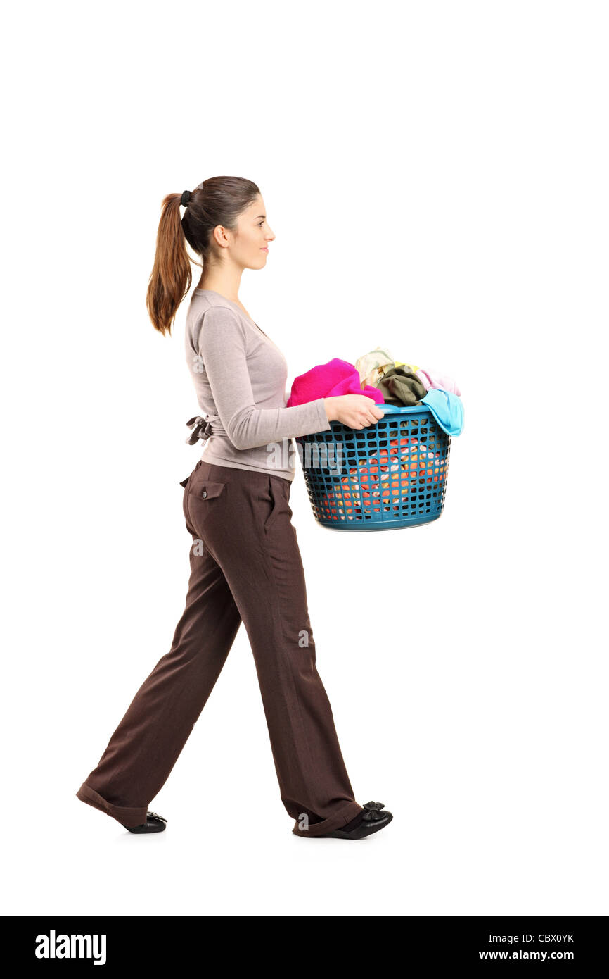 Full length portrait of a female holding a laundry basket Stock Photo