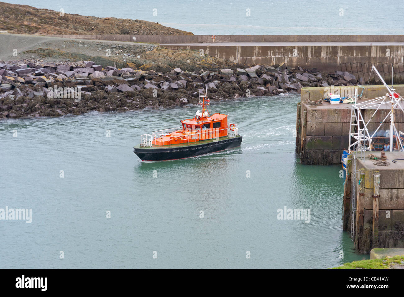 The pilot launch Fulmer coming in from a job off point lynas Amlwch Port Anglesey North Wales Uk Stock Photo