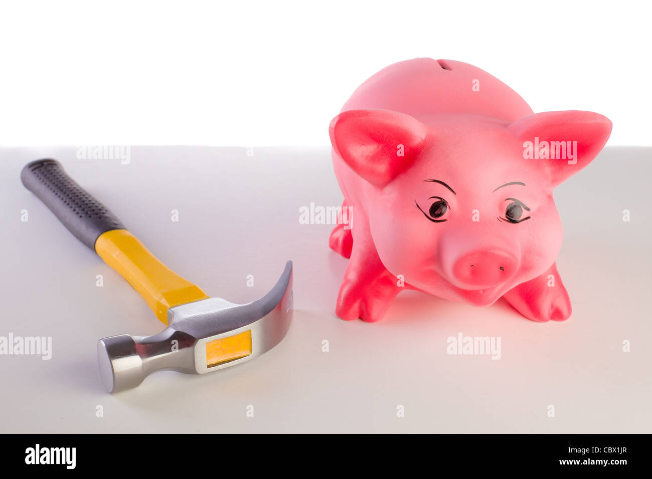 ceramic Piggy Bank with hammer Stock Photo - Alamy
