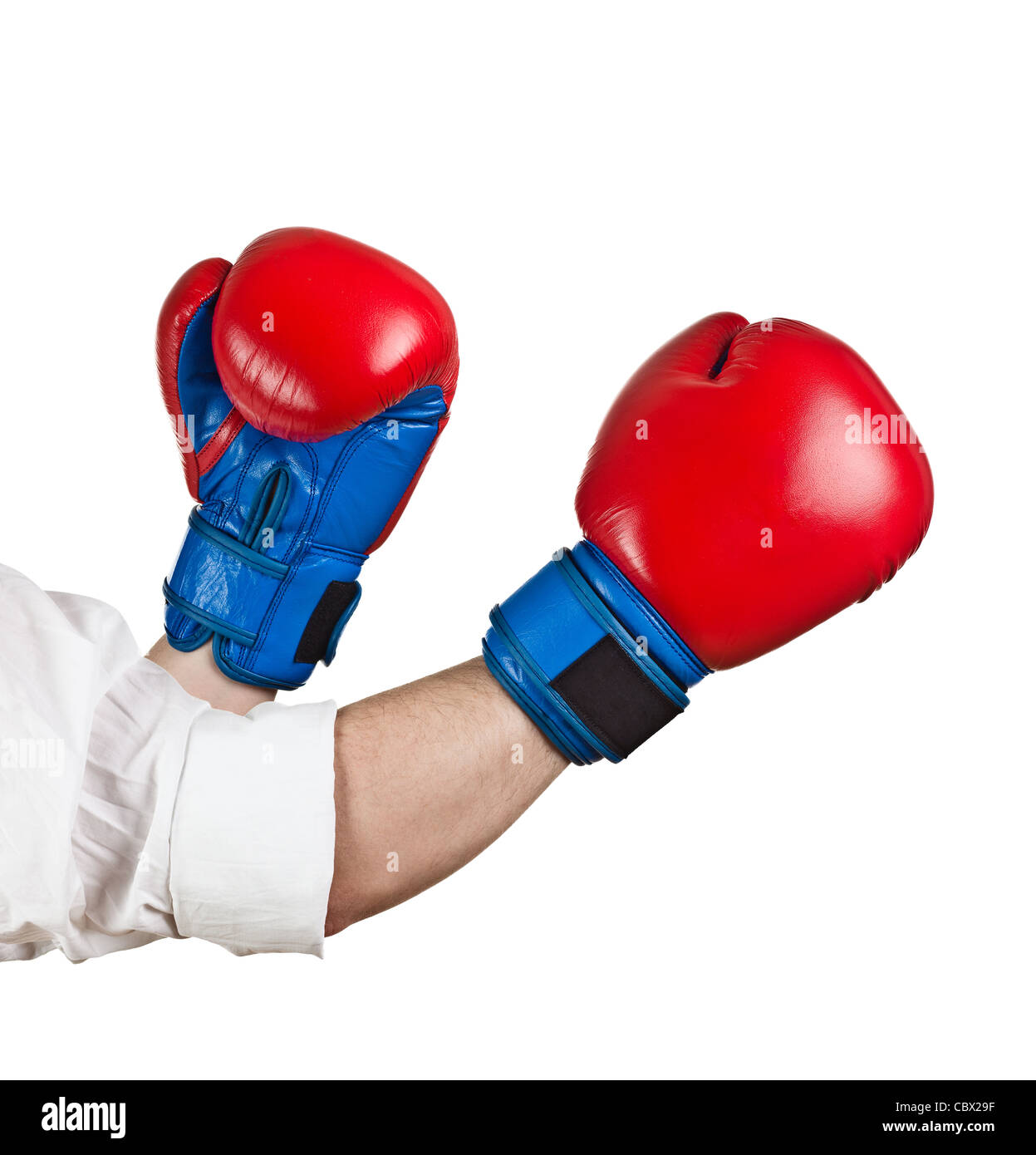 Man wearing white shirt and boxing gloves Stock Photo