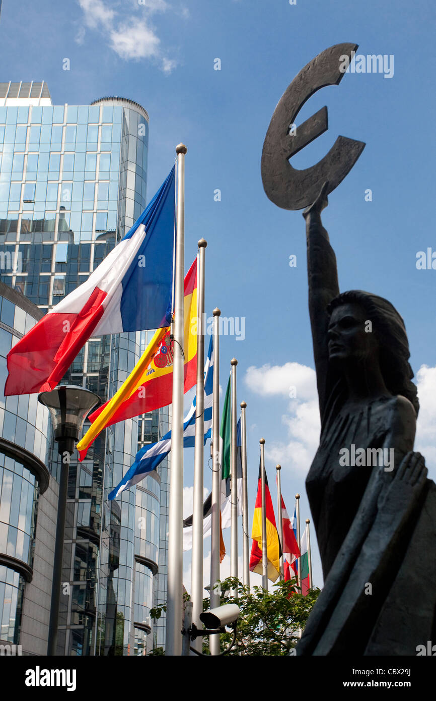 Statue with euro symbol and European flags in front of European