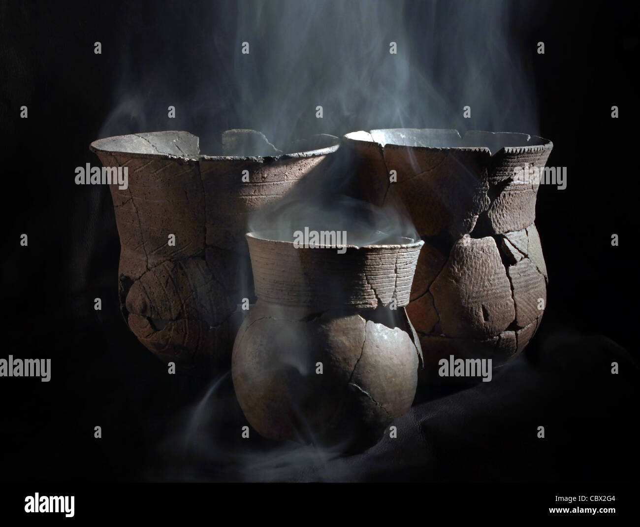 Ancient pottery photographed using smoke for ceremonial purposes. Stock Photo