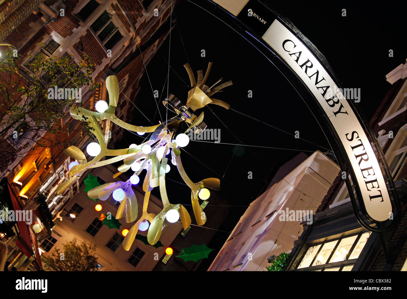 Christmas lights and decorations decorated like holly and mistletoe in