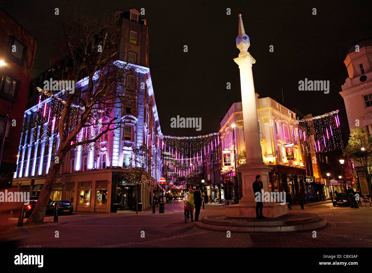 Pink Christmas lights and decorations at Seven Dials in Covent Garden