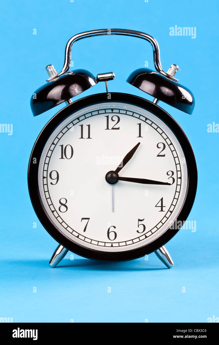 Classic clock on blue hi-res stock photography and images - Alamy