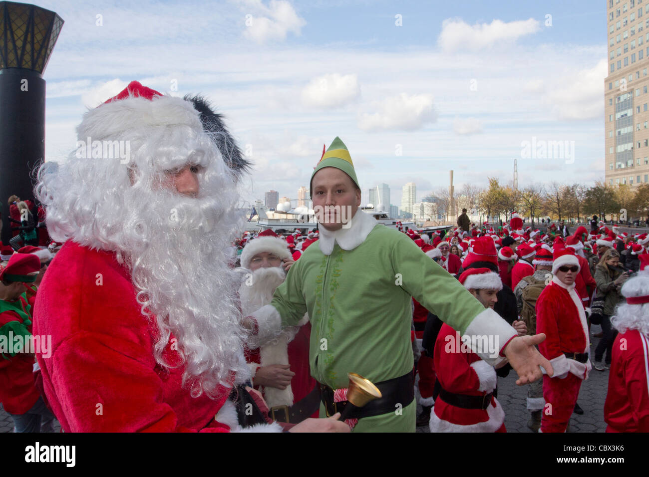 Thousands dressed as Santa Claus gather at the World Financial Center for Santacon 2011 Stock Photo
