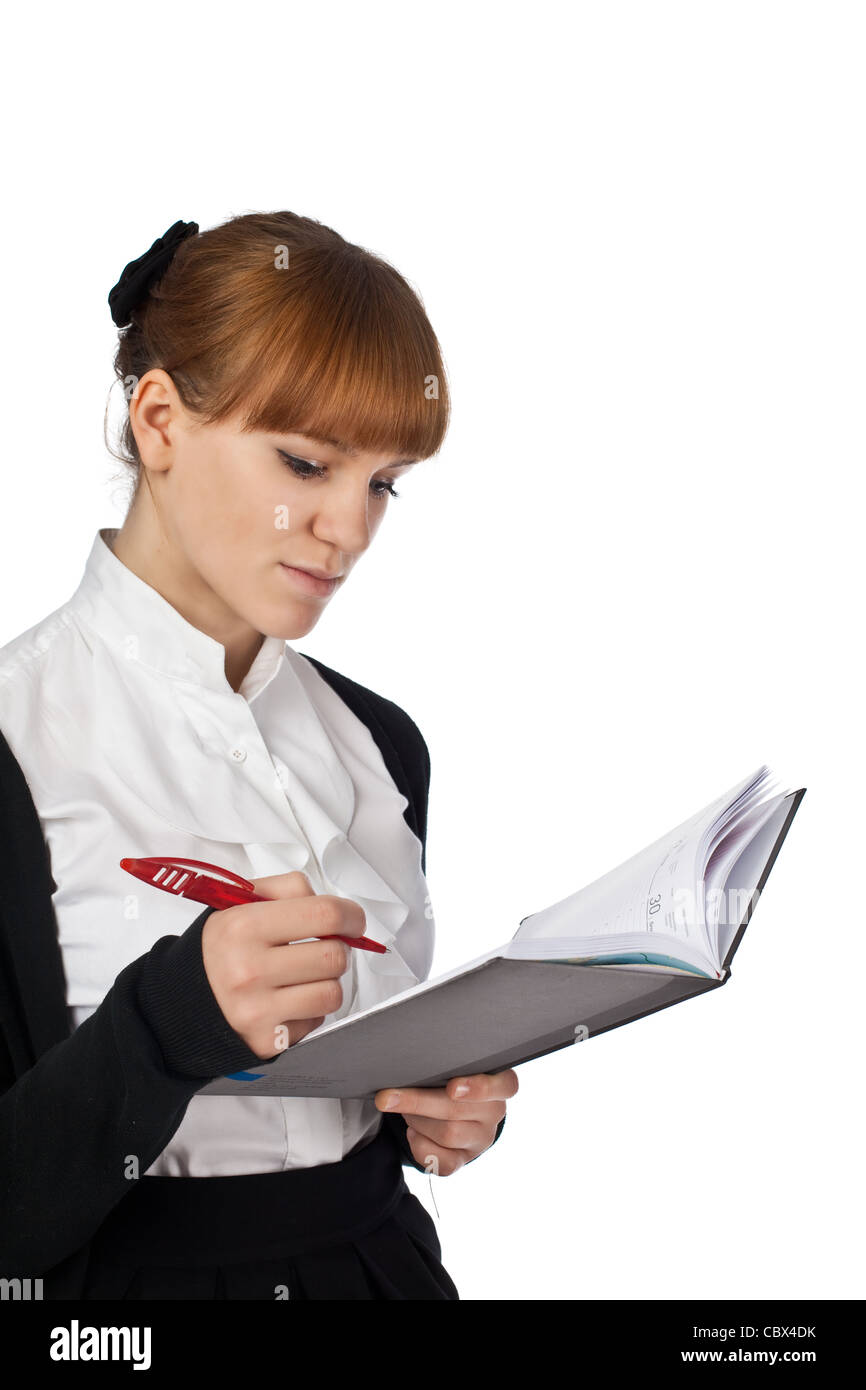 Female writing in organiser isolated on white background Stock Photo