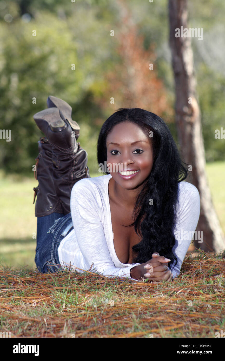 Beautiful Young Woman Lying in the Grass (1 Stock Photo - Alamy