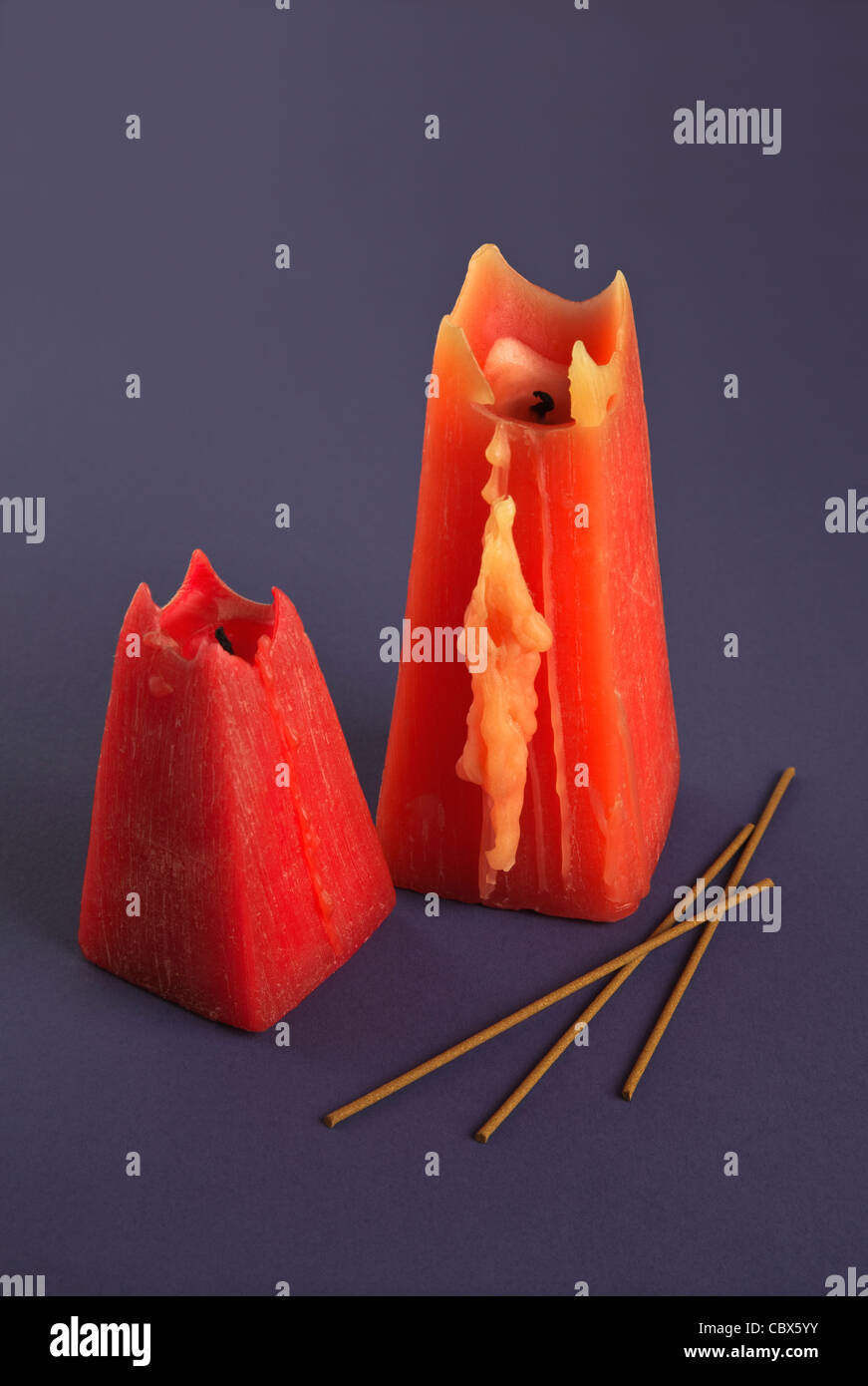 Two red Candles and incense sticks on blue background Stock Photo Alamy