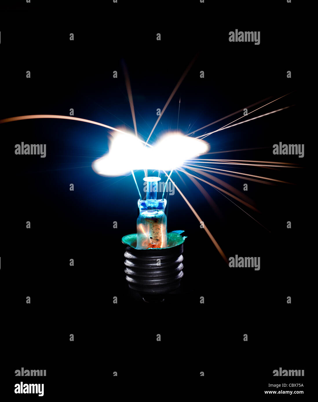 Broken Light bulb burning in dark Stock Photo Alamy