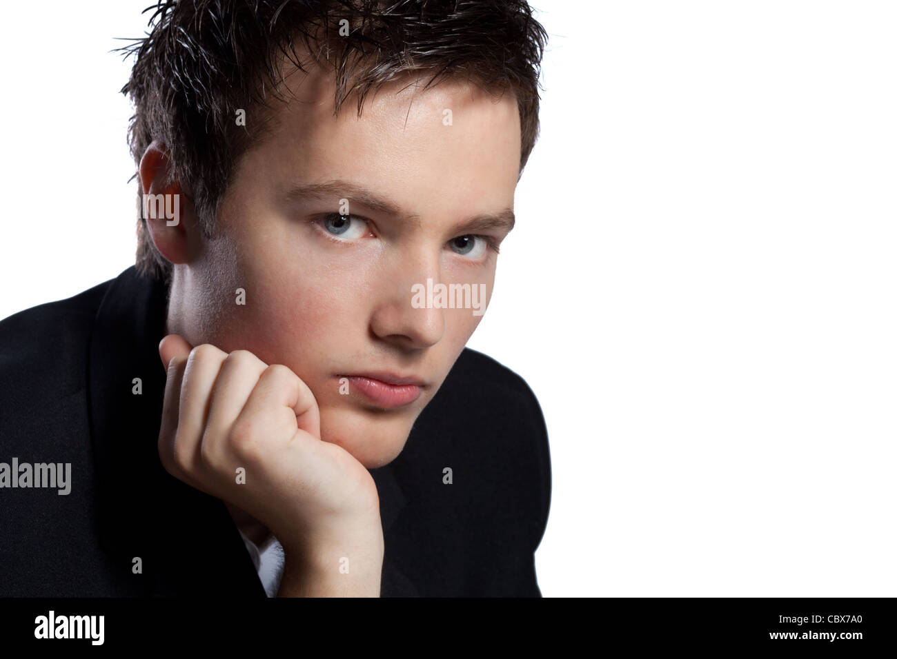 Confident man with his hand on his chin thinking Stock Photo