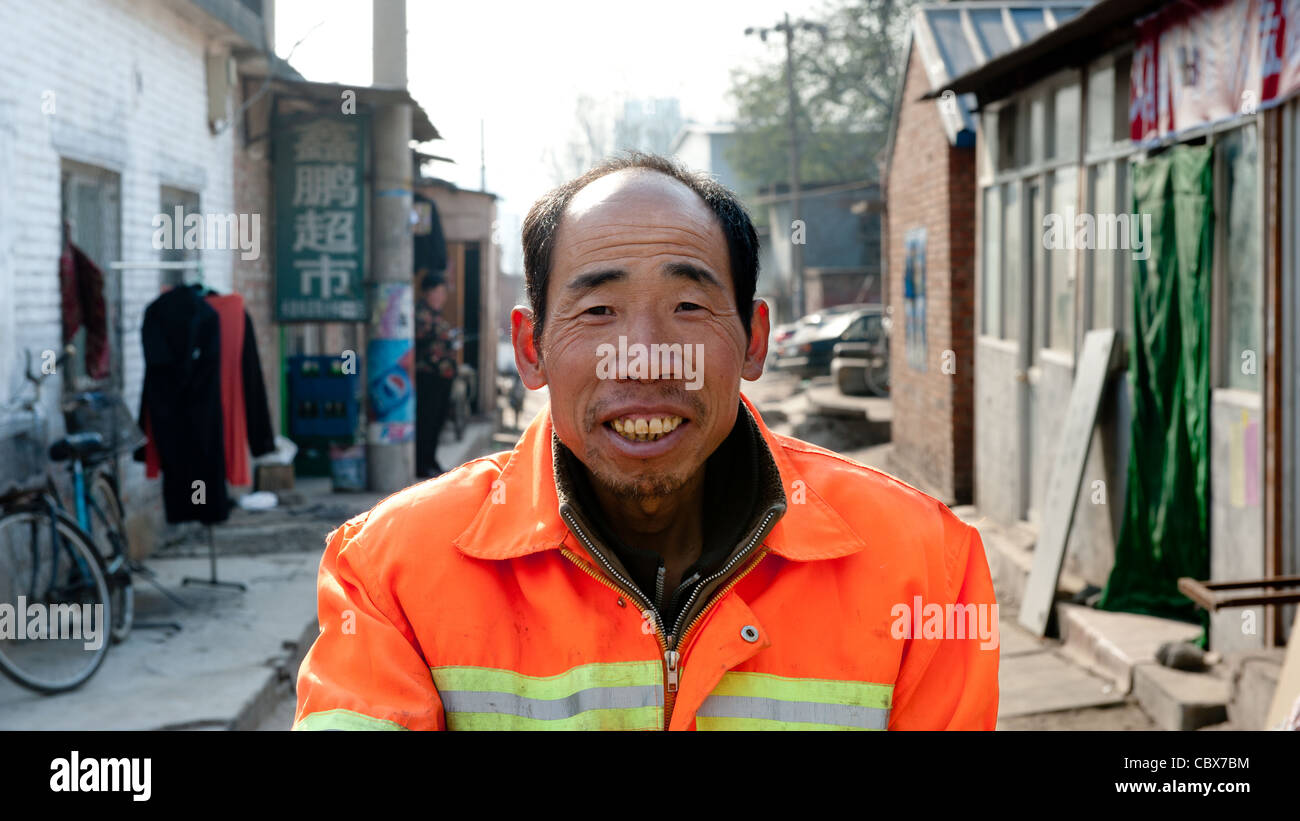 Beijing, Mr. Wang Longsheng. Mr. Wang works as a street cleaner in the Lidu area of Beijing. Stock Photo