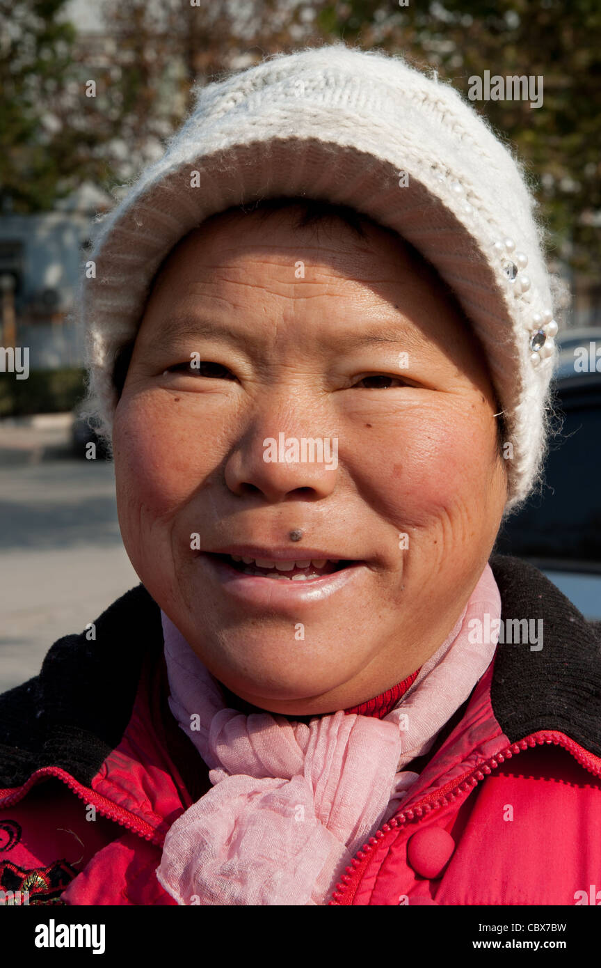 Beijing, Mrs. Li Yanhong. Mrs. Li is a street cleaner in the Lidu area of Beijing. Stock Photo