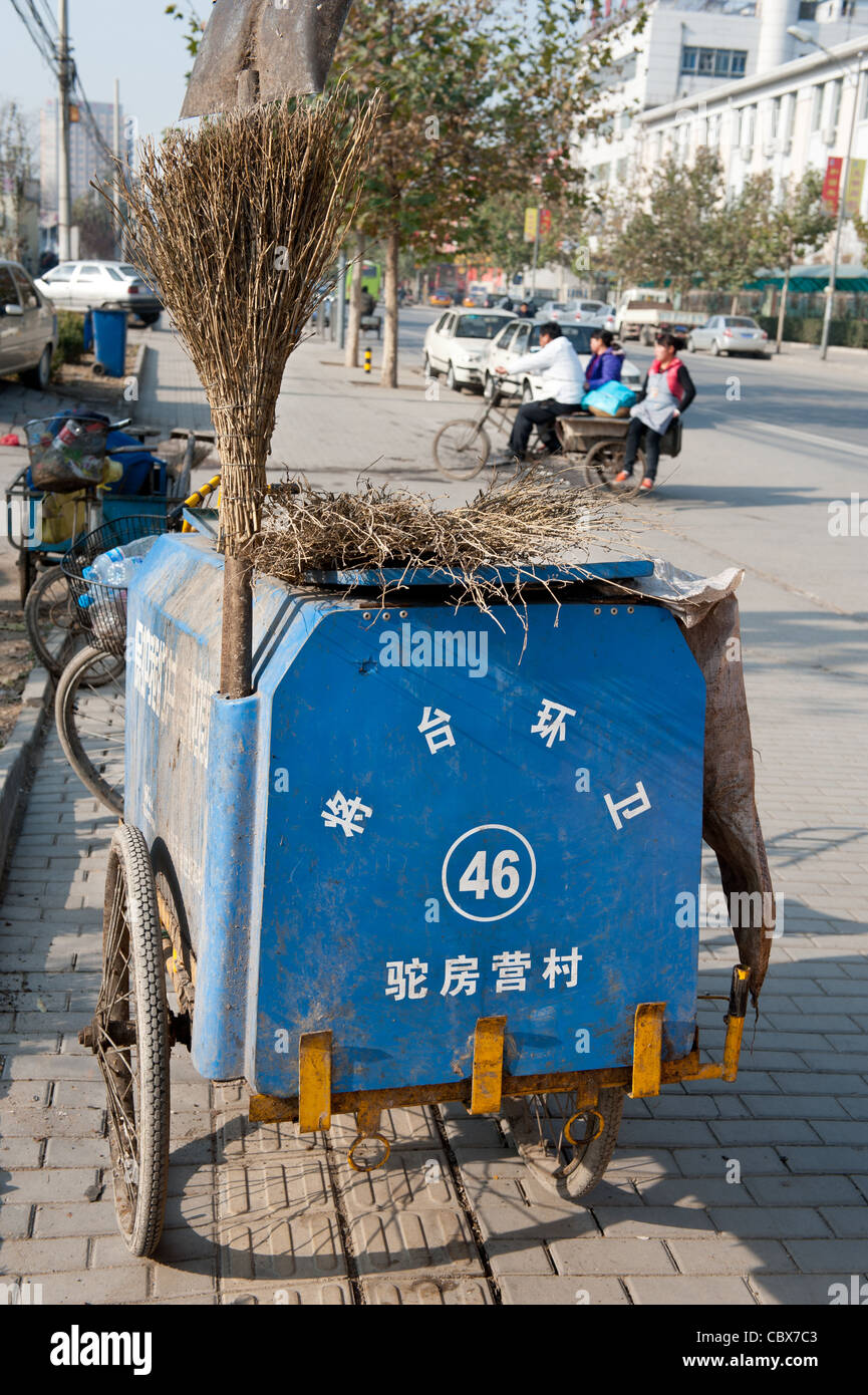 Beijing, Lidu area. Cart of a street cleaner. Stock Photo