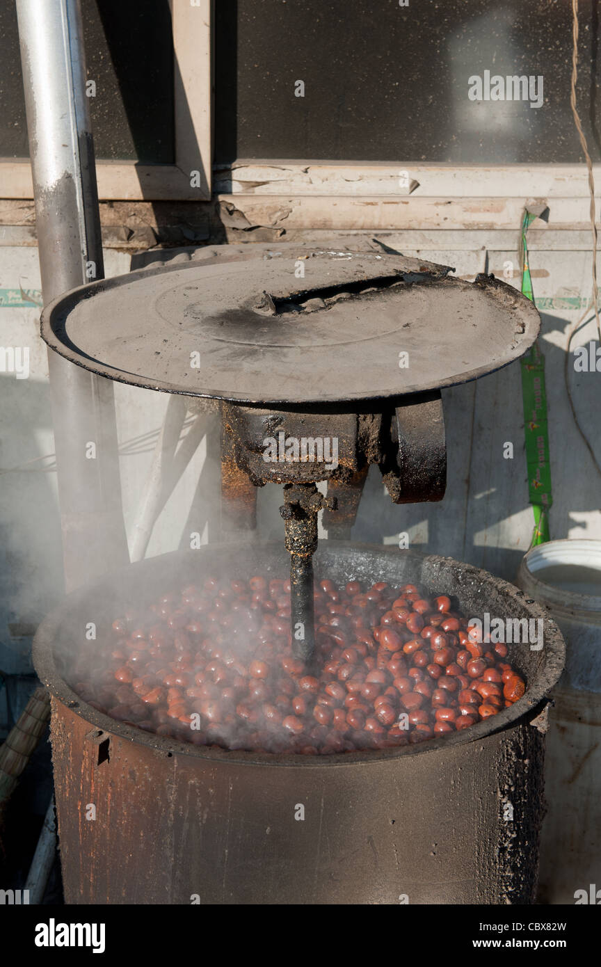 DongBaXiang, Beijing. Chestnuts being boiled on a market. Stock Photo