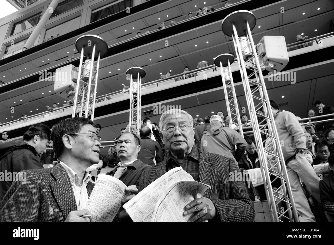 Sha Tin, Hong Kong. Spectators at the race track of the Hong Kong Jockey Club. Stock Photo