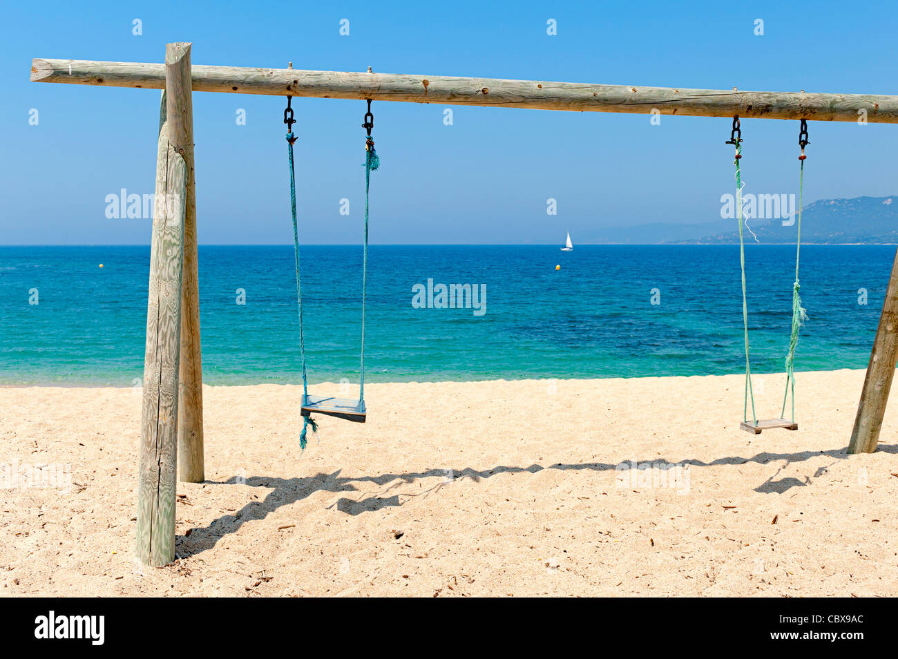 Double swing on beach by the sea Stock Photo Alamy