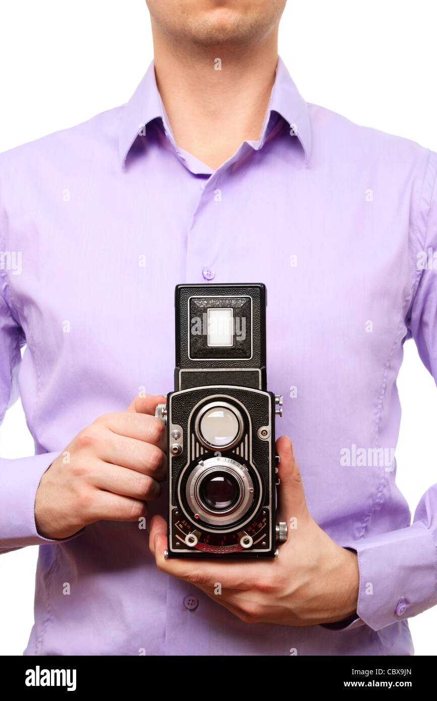 Close up image of man with old photo camera. Isolated over white background. Stock Photo