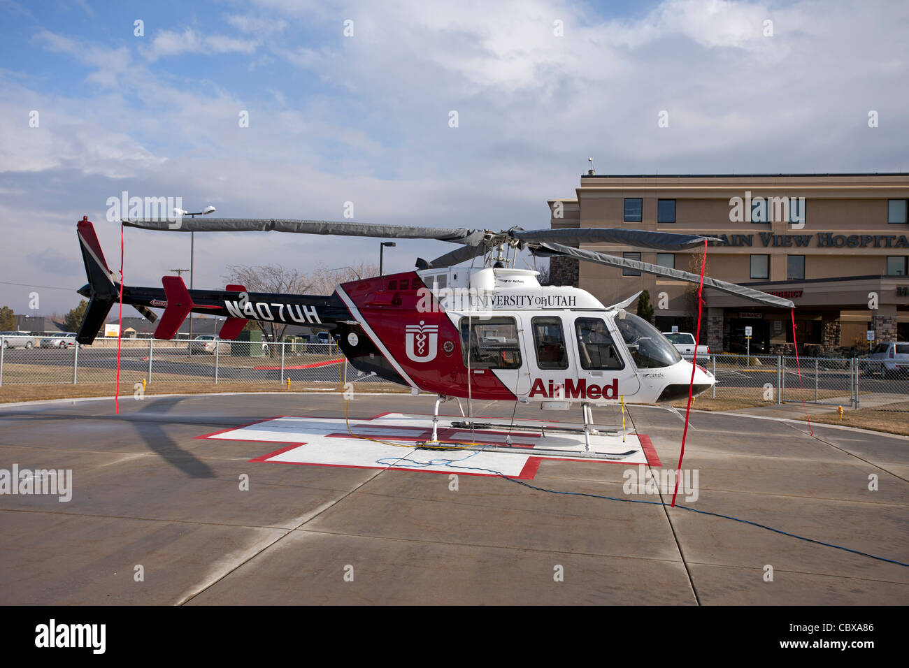 Helicopter AirMed side from University of Utah Medical Center pilot getting ready for emergency flight in front of hospital. Stock Photo