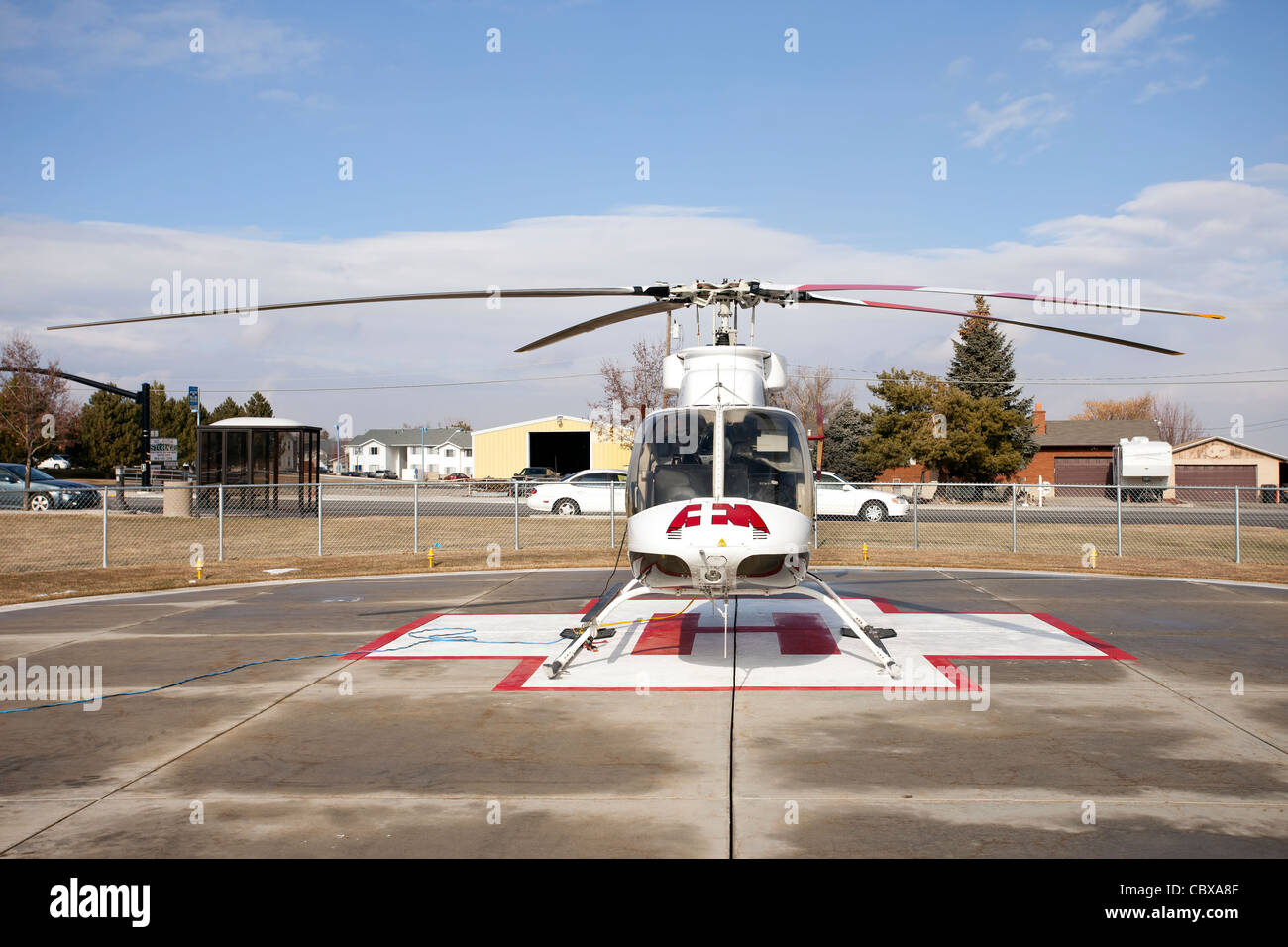 Helicopter AirMed front from University of Utah Medical Center pilot getting ready for emergency flight in front of hospital. Stock Photo