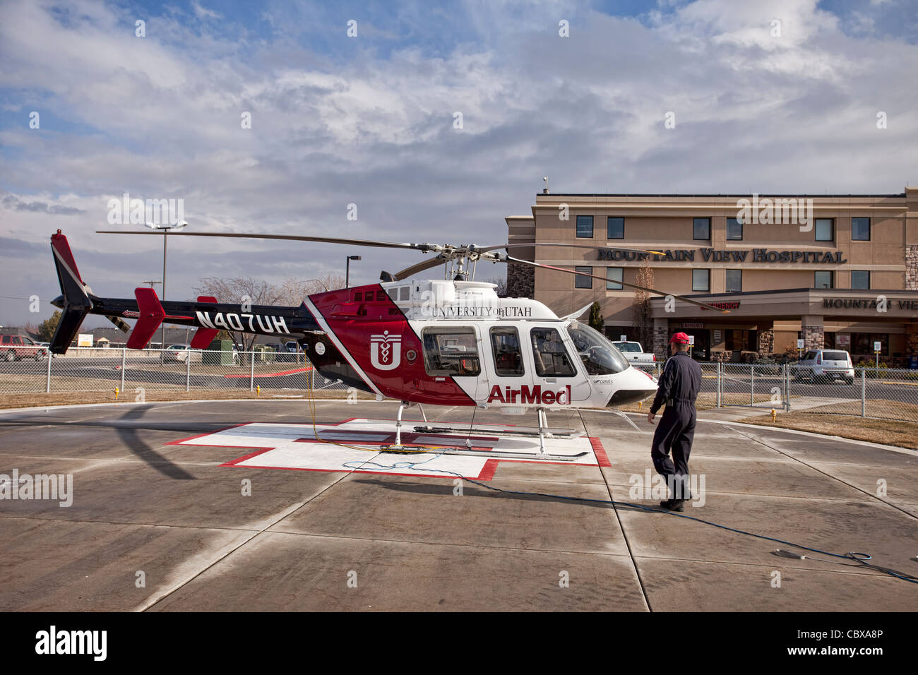 Helicopter pilot AirMed from University of Utah Medical Center pilot getting ready for emergency flight in front of hospital. Stock Photo