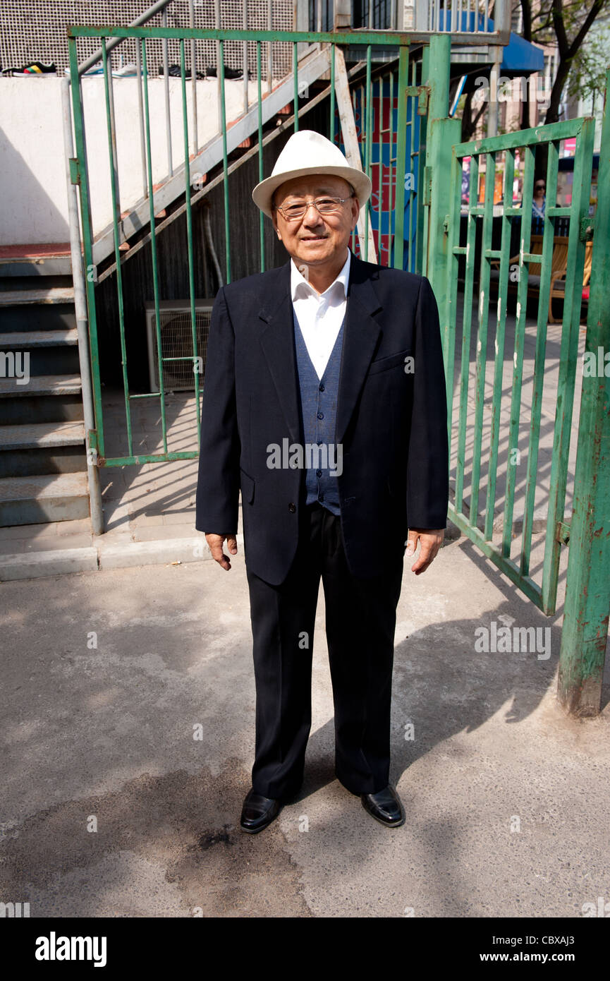 Beijing. Mr. Xu GuangCheng, a retired civil servant, walking in the Ritan Park area of Beijing. Stock Photo