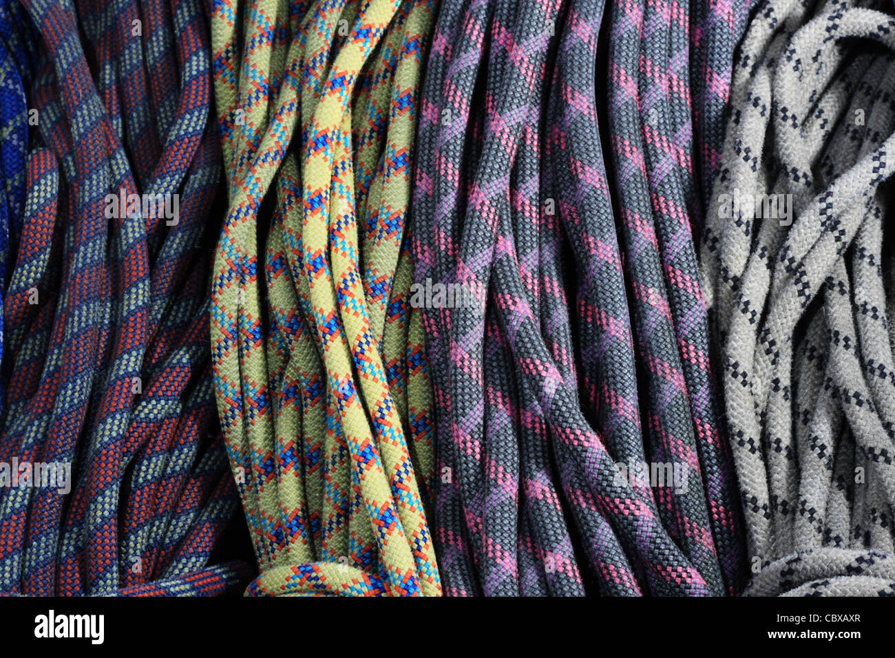 many old used rock climbing ropes in bundles Stock Photo Alamy