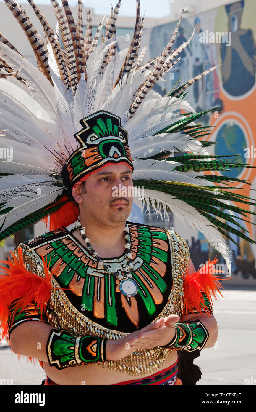 Native American man in feathered headdress participating in the annual  Carnaval festival in San Francisco, California Stock Photo - Alamy