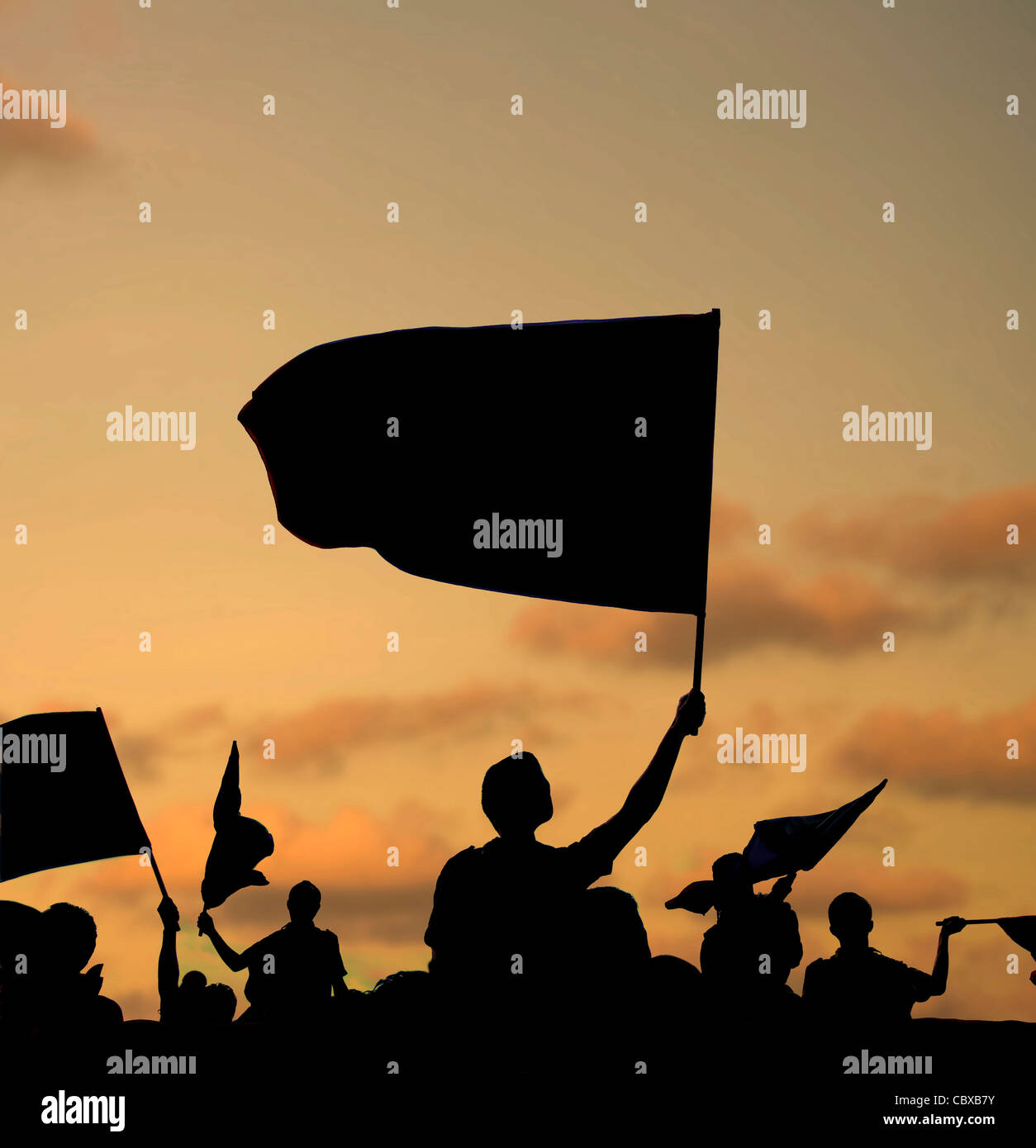 silhouette of street protestors with flags and banners Stock Photo