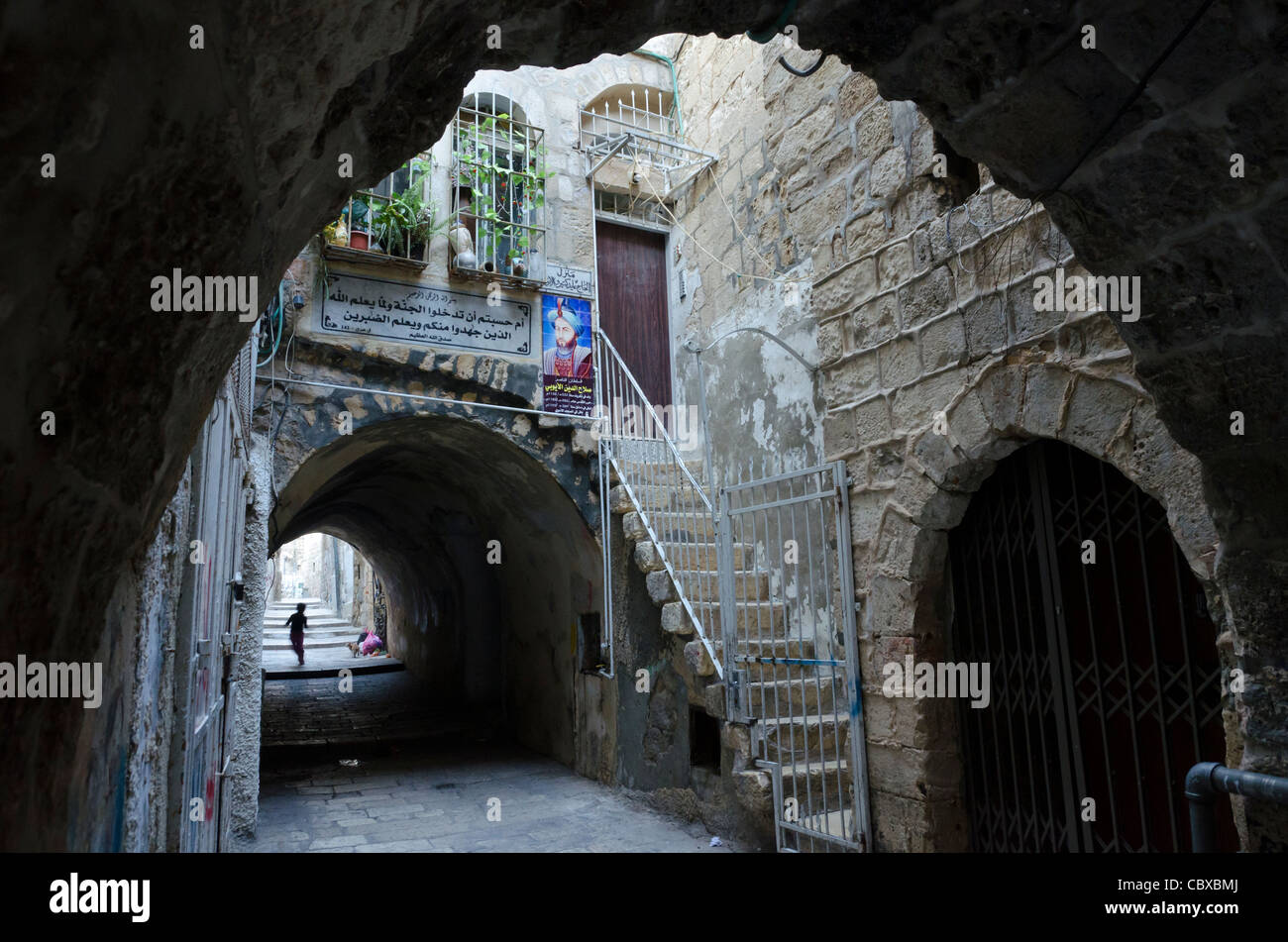 Street with arches and portrait of Salah ad din. Jerusalem Old City. Israel Stock Photo