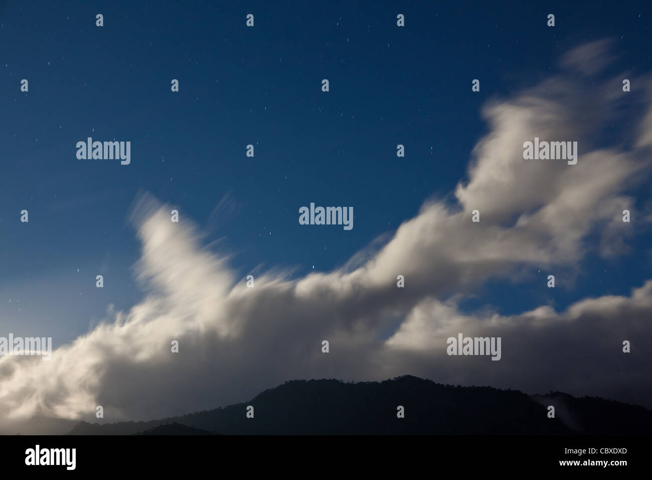 Moonlit clouds are drifting over Volcan Baru national park, Chiriqui province, Republic of Panama. Stock Photo