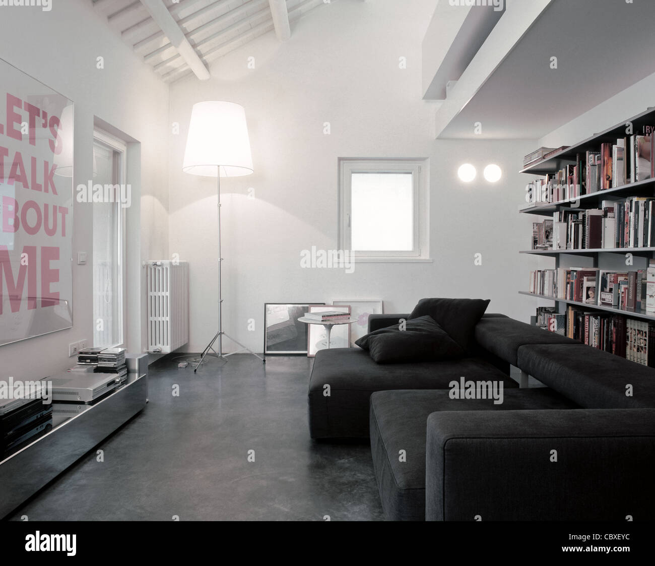 modern living room couch in the attic with gray cloth and resin floor Stock Photo