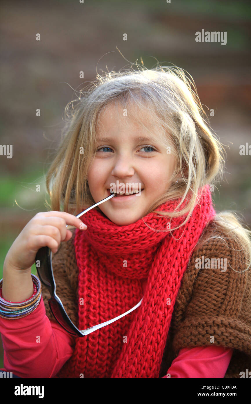 portrait of blond girl smiling outside autumn day Stock Photo - Alamy