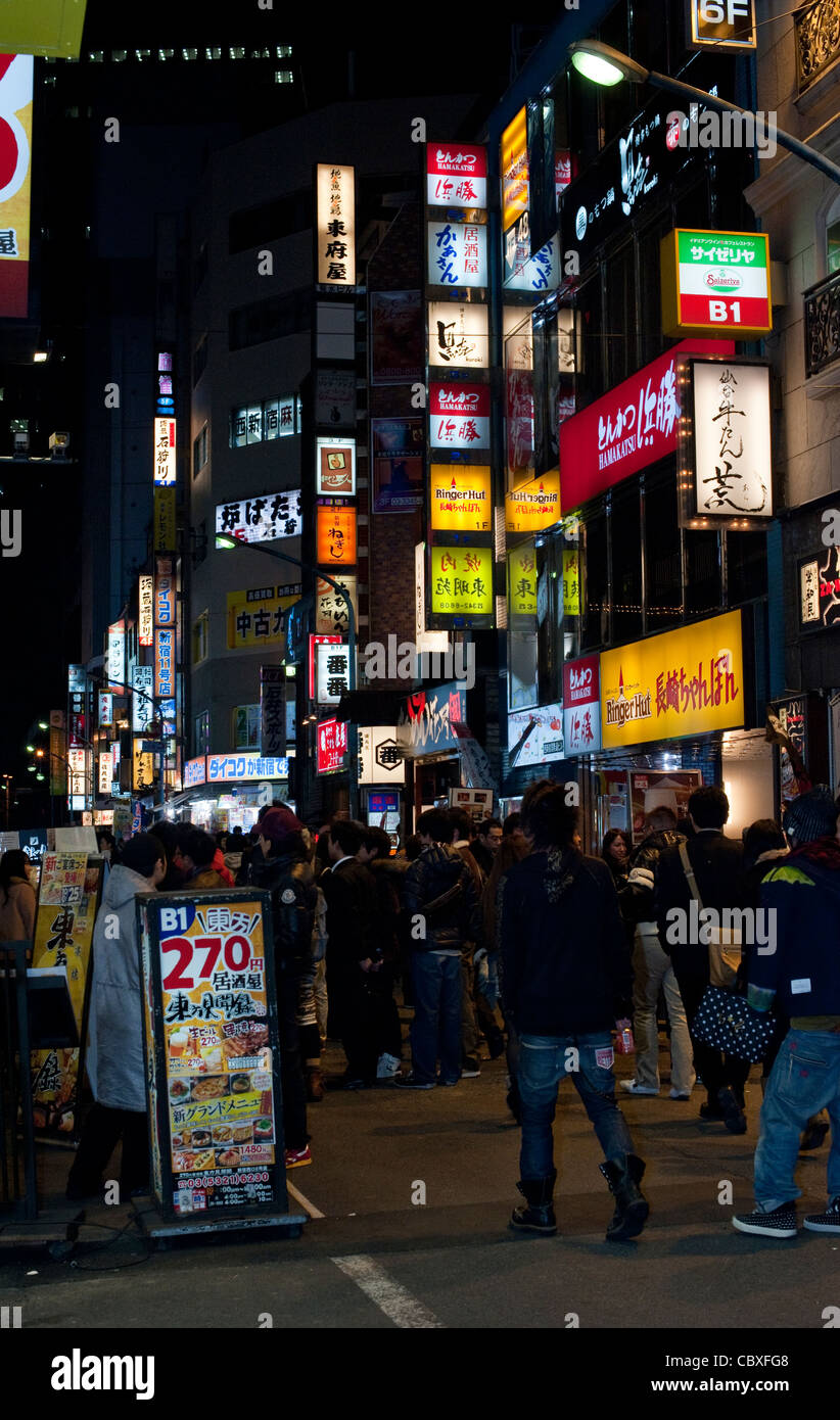 Tokyo city landscape with bright advertising lights at night Stock Photo