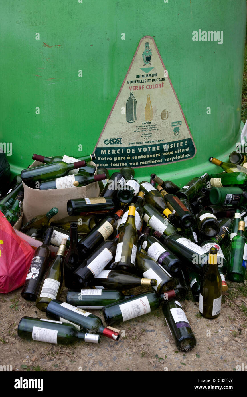Glass collection point / Bottle bank with dumped wine bottles in front