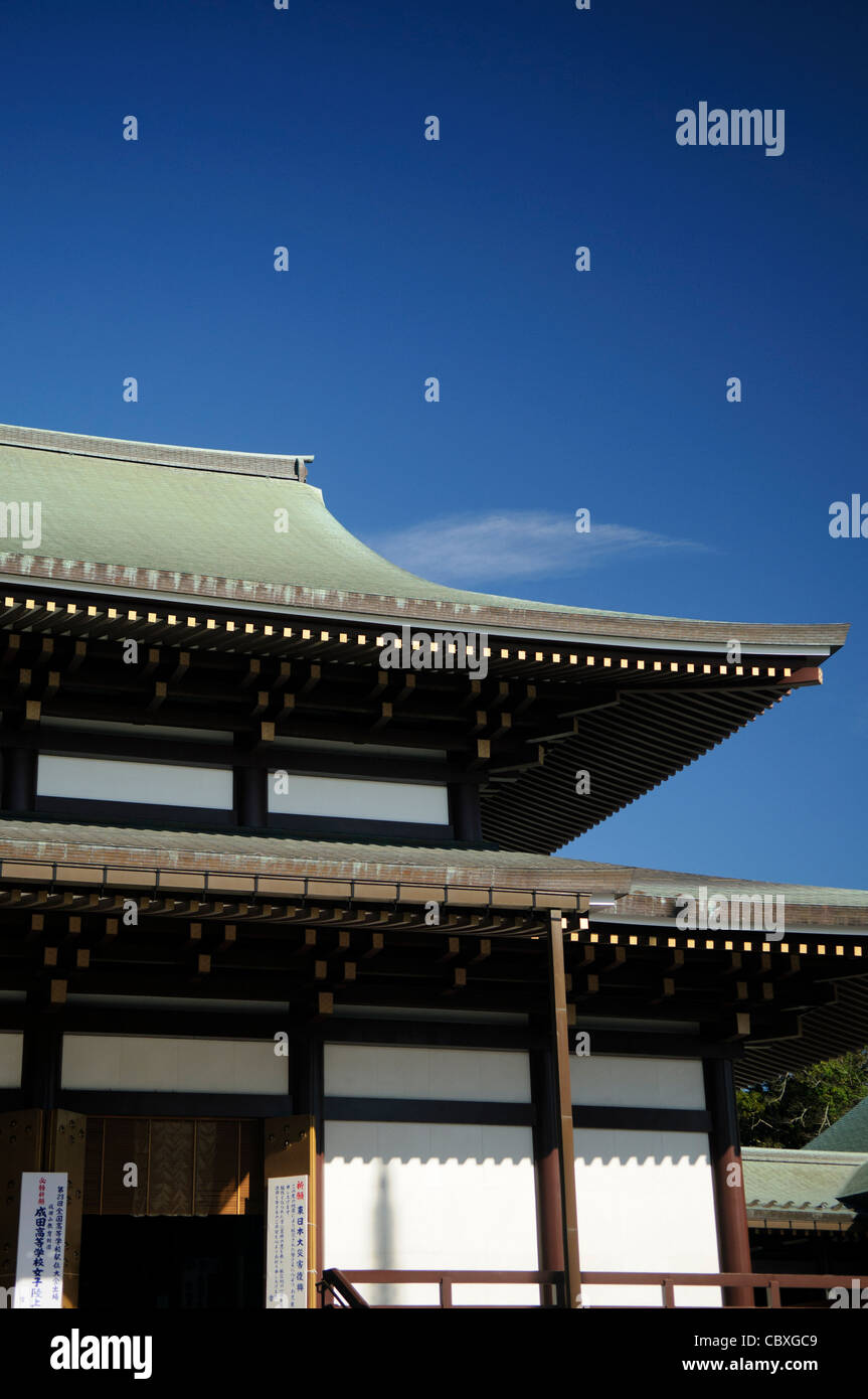 NARITA, Japan - The Great Main Hall's stepped roof with copyspace of clear blue sky. The Narita-san temple, also known as Shinsho-Ji (New Victory Temple), is Shingon Buddhist temple complex, was first established 940 in the Japanese city of Narita, east of Tokyo. Stock Photo