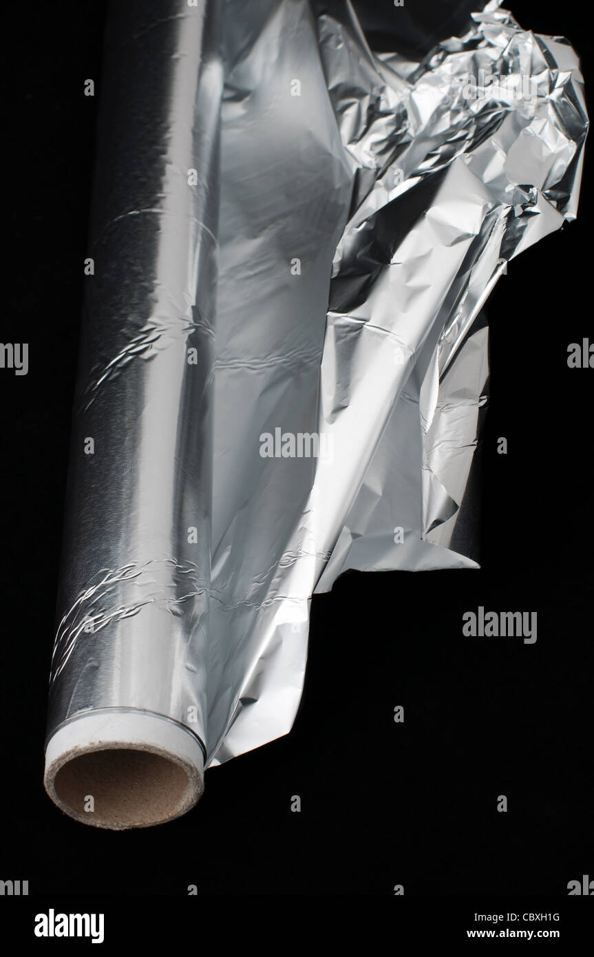 Cook Aluminum Foil on black background Stock Photo