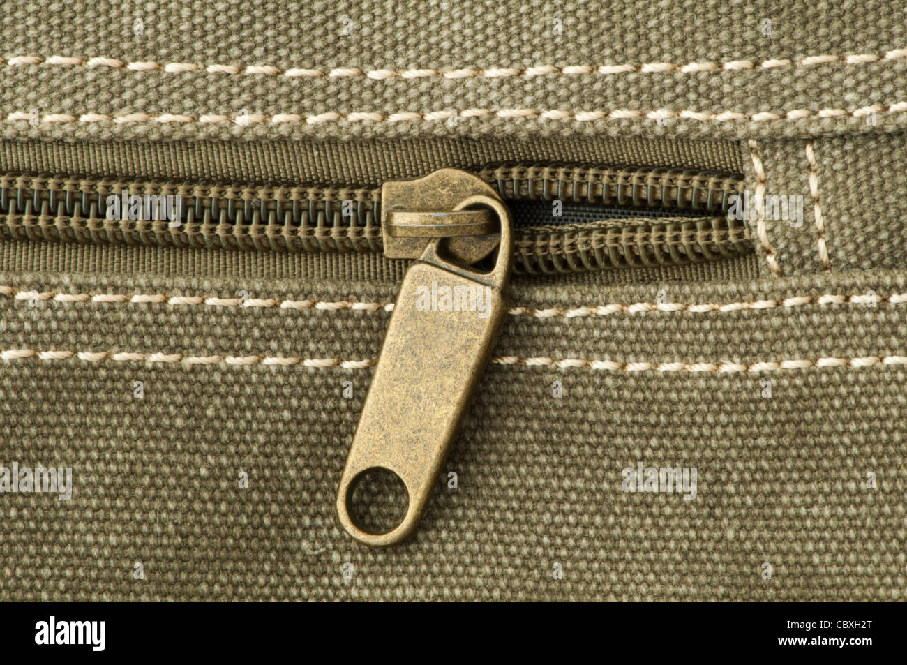 Beige zip on bag and sewing fabric Stock Photo