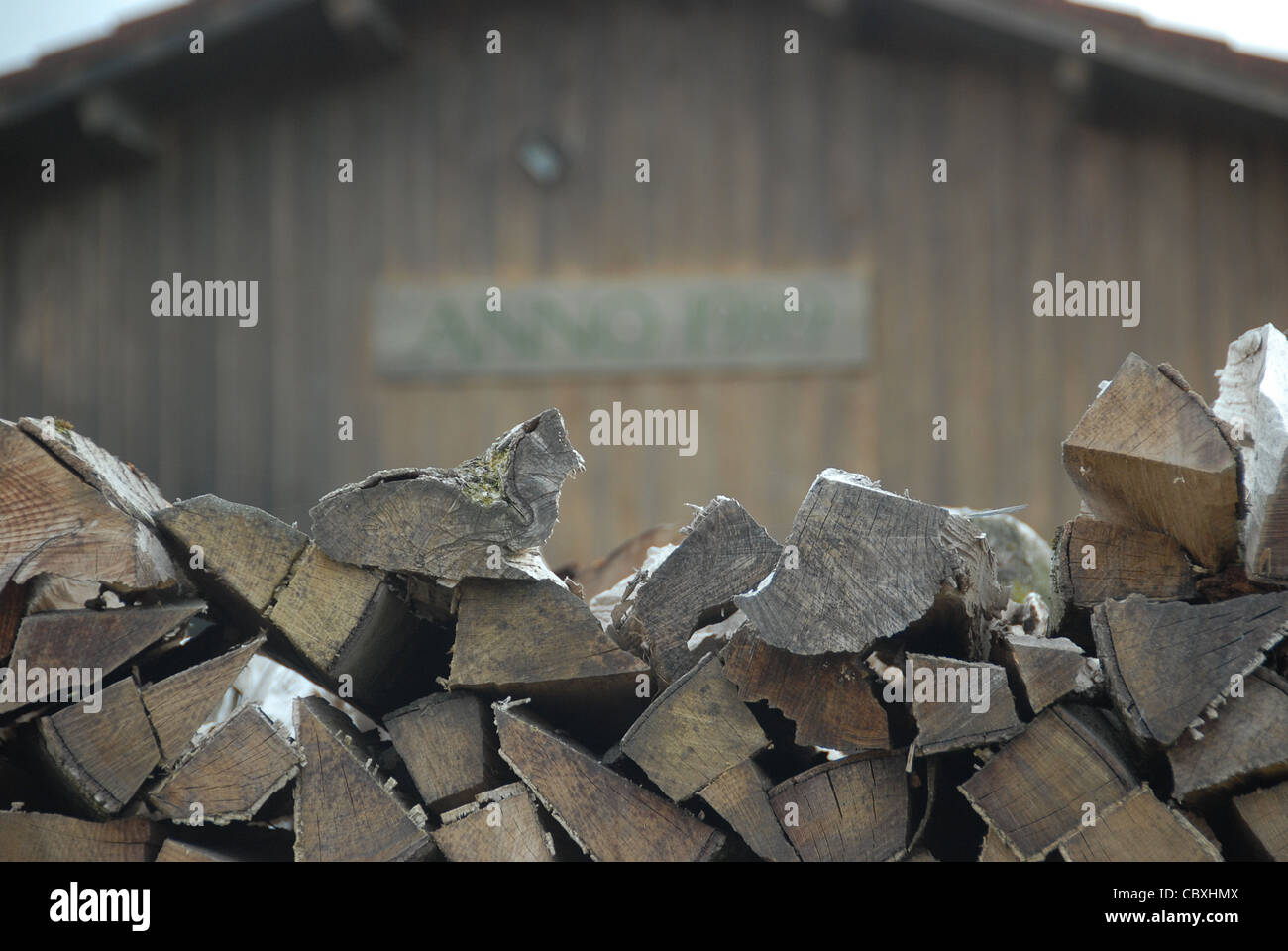 Firewood, properly stacked up on a farm at Peißenberg in Bavaria's Pfaffenwinkel, southern Germany Stock Photo