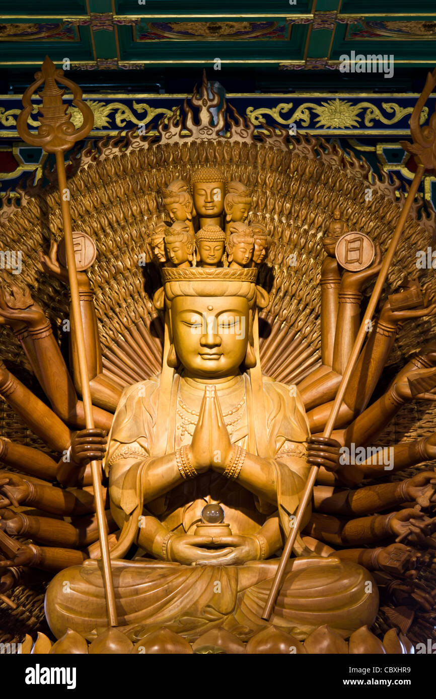 Thousand hands of god image make of wood carving chinese art in thailand Stock Photo Alamy