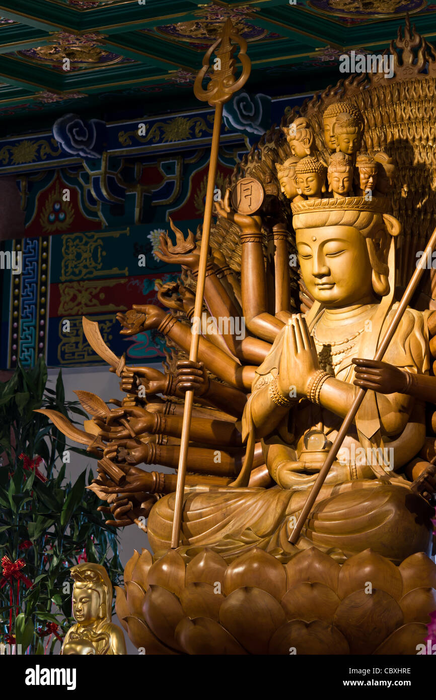 Thousand hands of god image make of wood carving chinese art in thailand Stock Photo Alamy