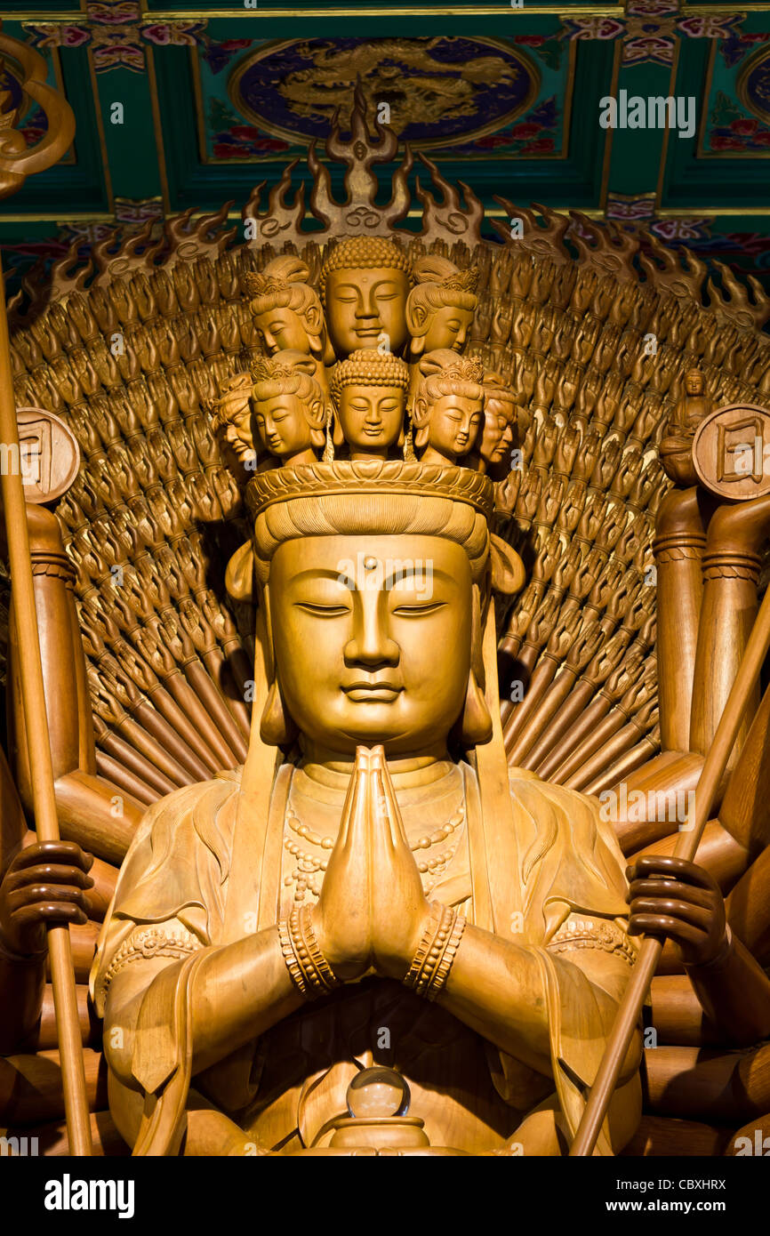 Thousand hands of god image make of wood carving chinese art in thailand Stock Photo Alamy