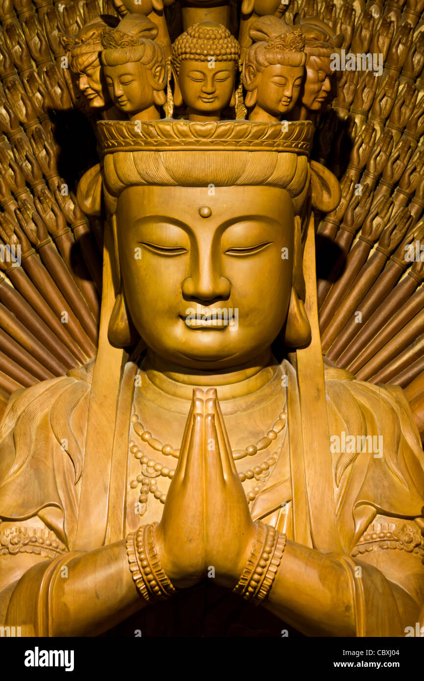 Thousand hands of god image make of wood carving chinese art in thailand Stock Photo Alamy