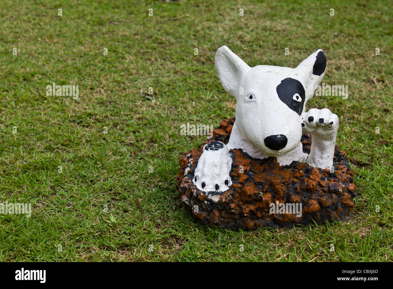 statue of a dog decorated on the lawn Stock Photo Alamy