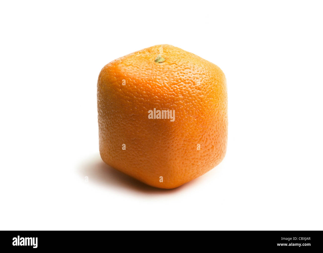 Square (cube) orange on a white surface, representing