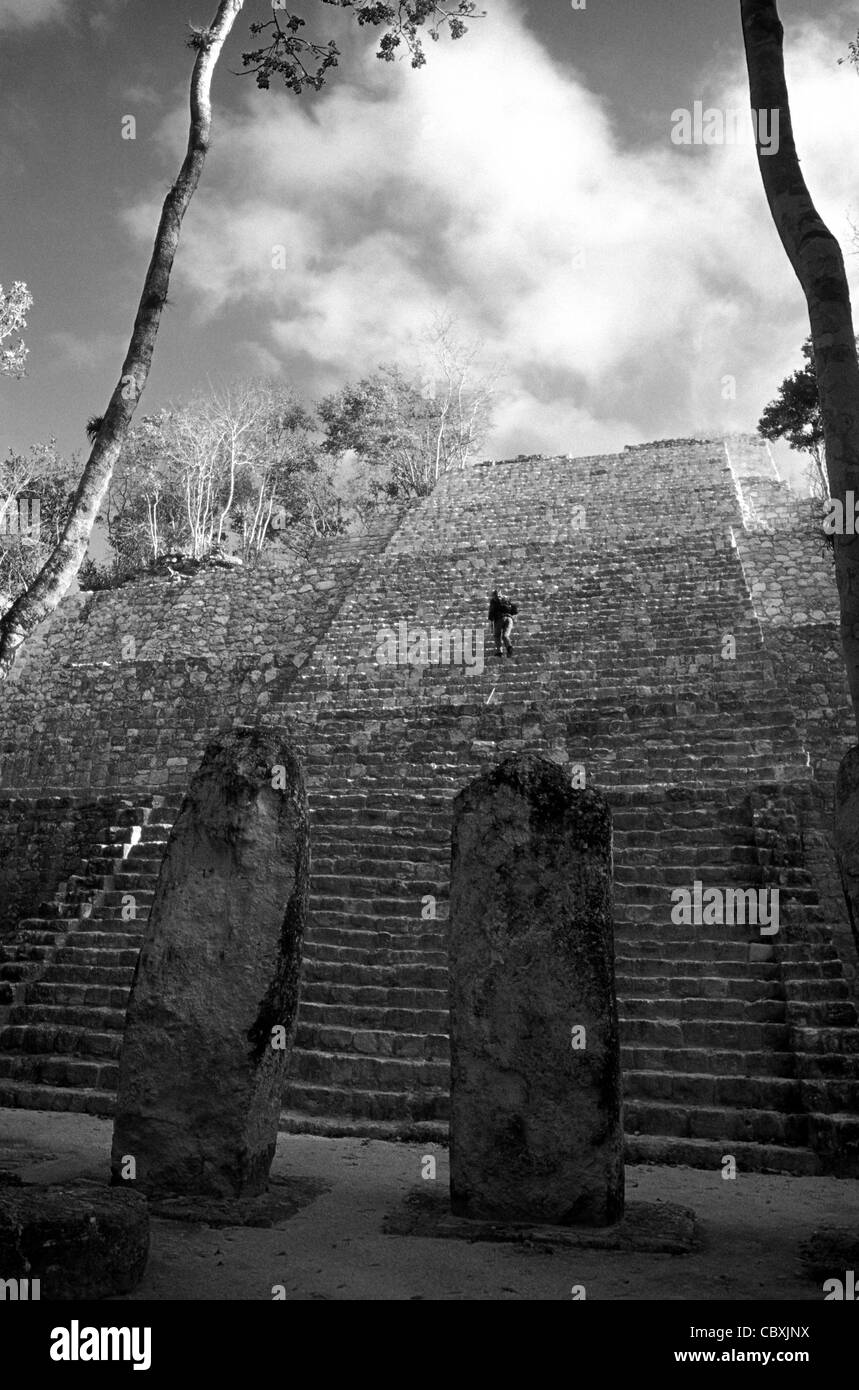 Person climbing Structure VII at the Mayan ruins of Calakmul, Campeche, Mexico. Stock Photo