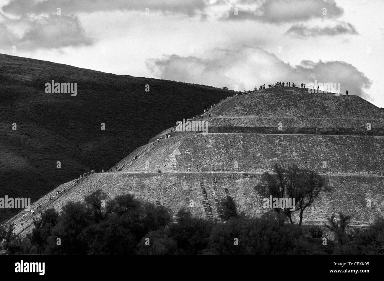 Black and white photograph (infrared effect) of people climbing the Pyramid of the Sun, Teotihuacan, Mexico Stock Photo