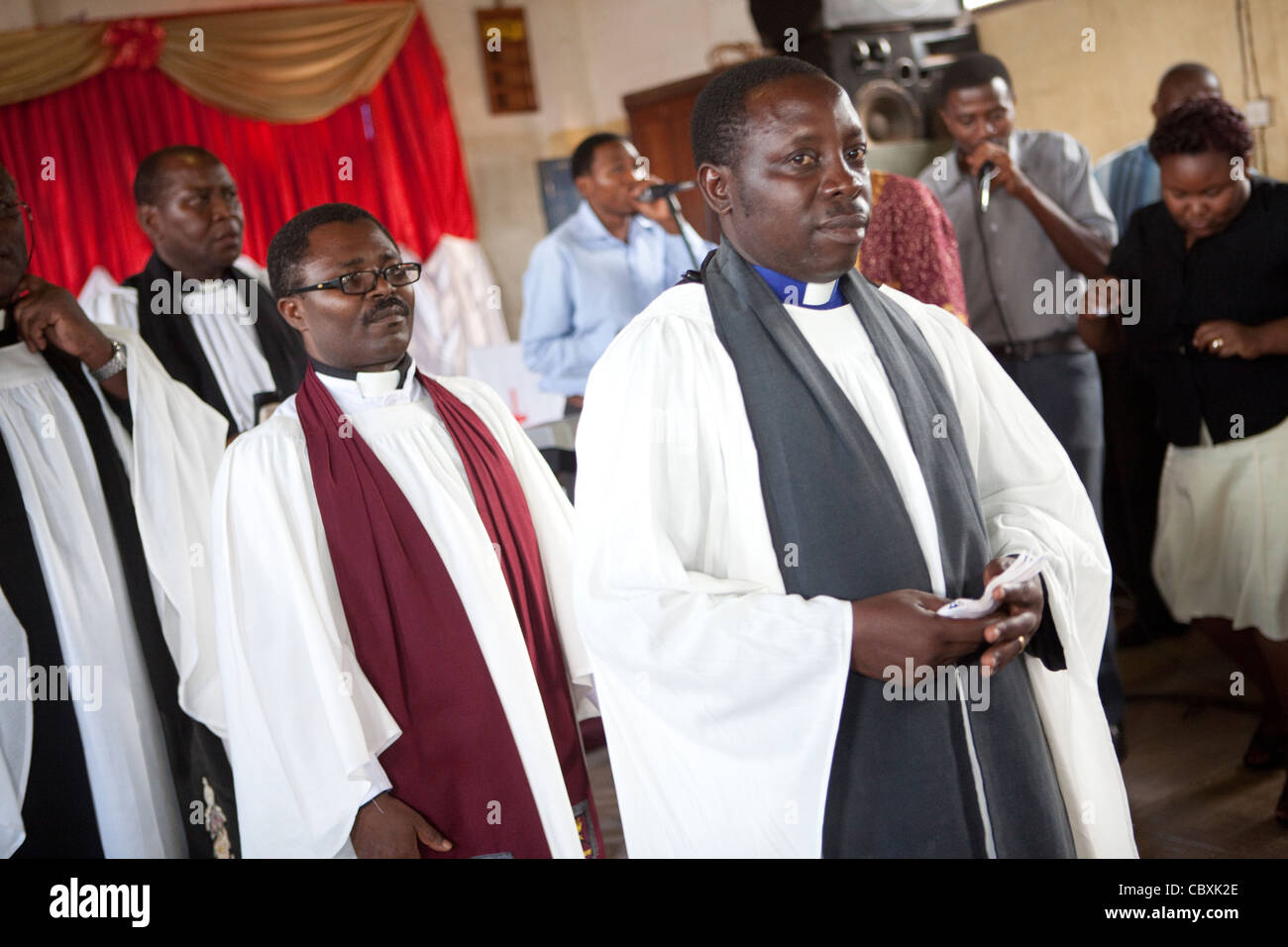 Priests move in procession during a church service in Morogoro, Tanzania, East Africa. Stock Photo