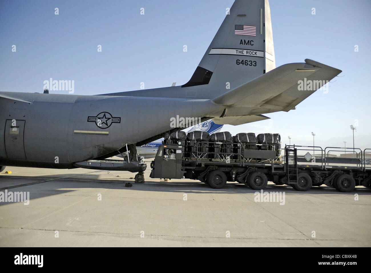 Pallets of JP-8 fuel rigged for an airdrop are loaded into the cargo bay of  a C-130J Super Hercules July 17, Kandahar Air Field, Afghanistan. The 772nd  Expeditionary Airlift Squadron perform airdrops